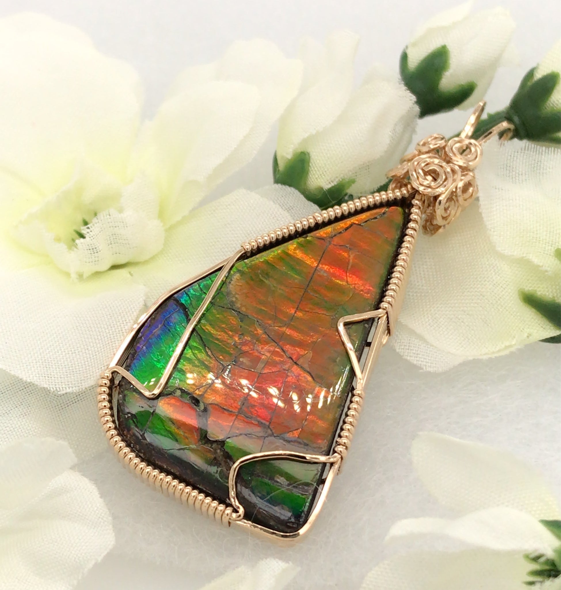 Barb Murrin Jewelry - Orange and green ammolite pendant with white flowers
