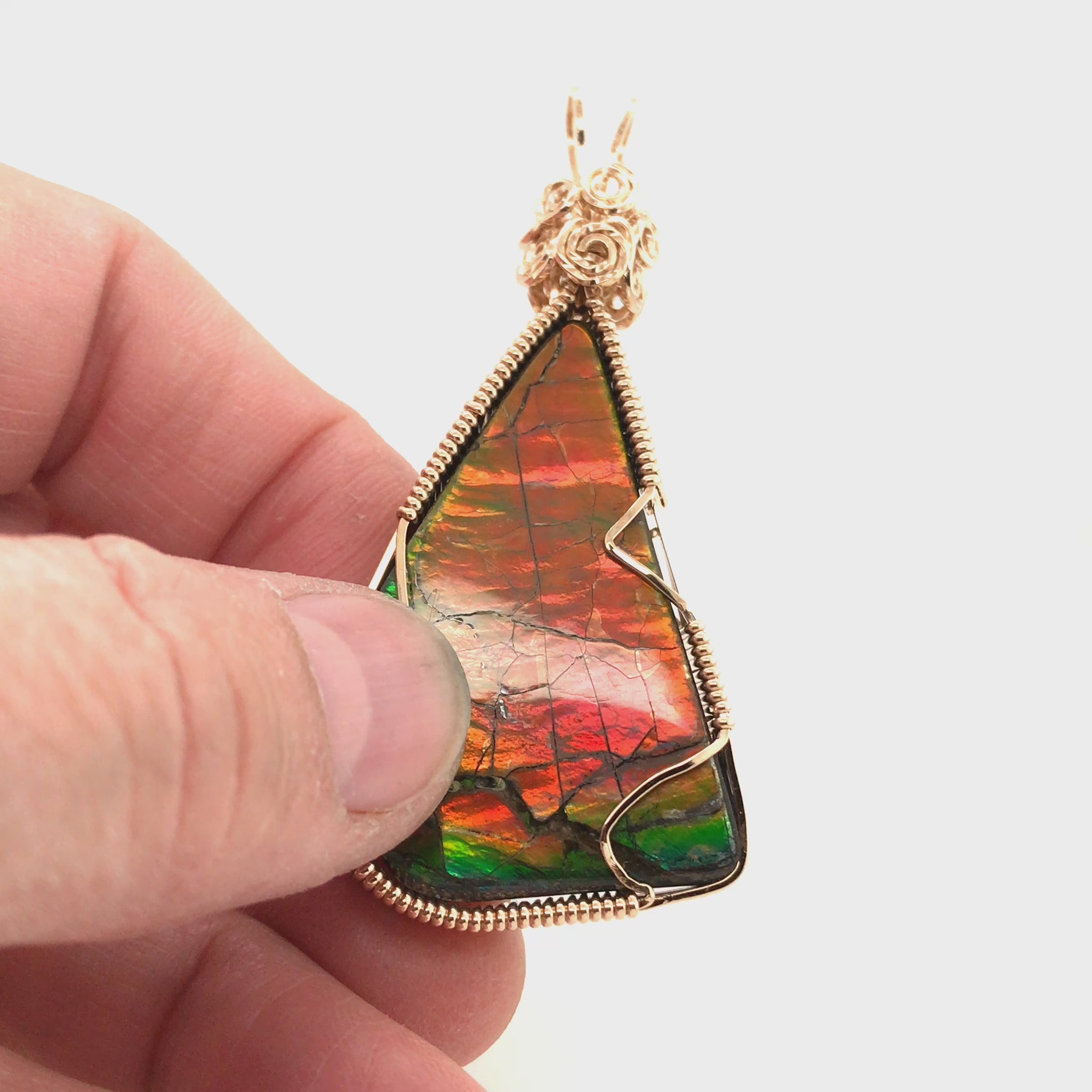 Video, 360 degrees. Orange and Green Ammolite Pendant.