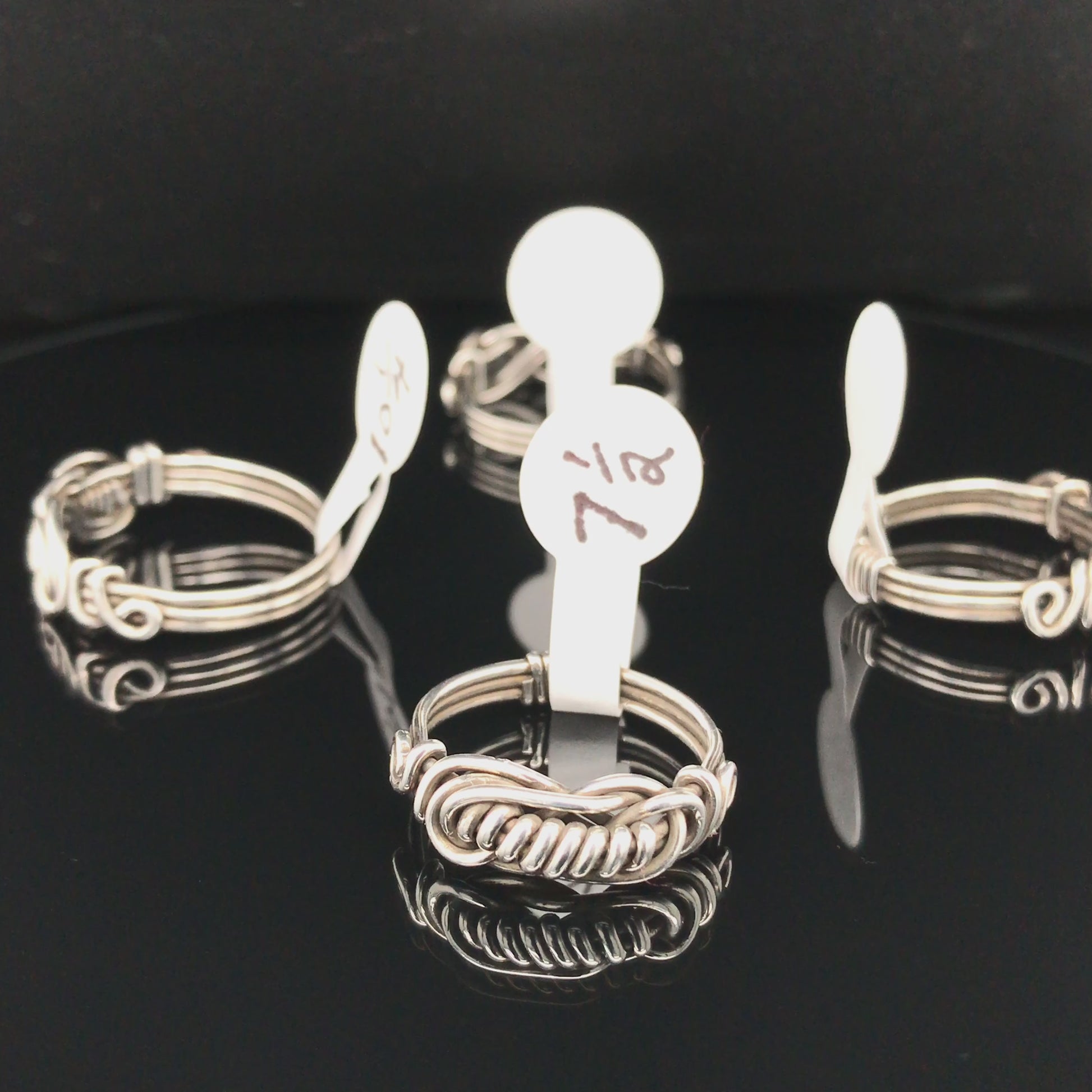 Movie, Argentium silver knotted rings with wrapped centers.