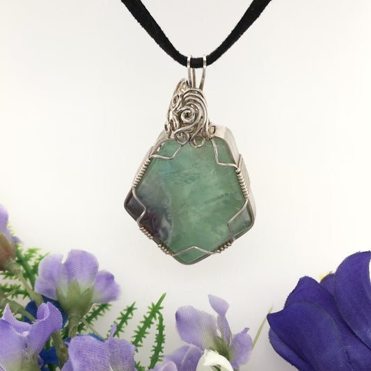 Video, 360 degrees. Fluorite and Argentium silver pendant "Soul of a Mountain Lake," hanging from black suede cord.