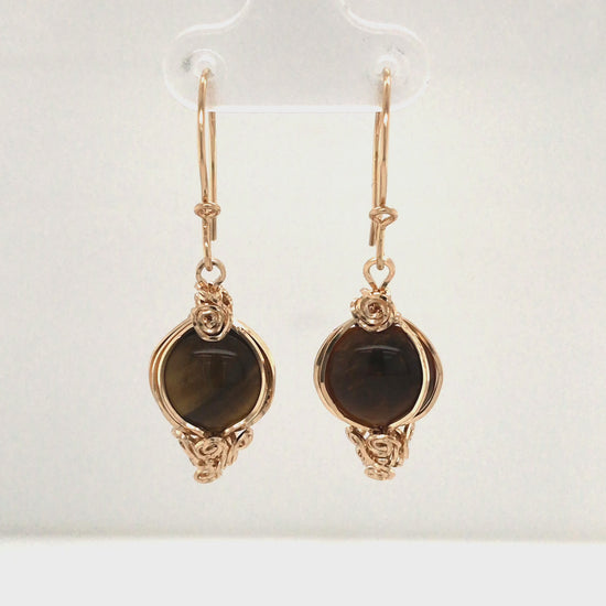 Video, 380-degree, Semi-ornated tiger's eye earrings.