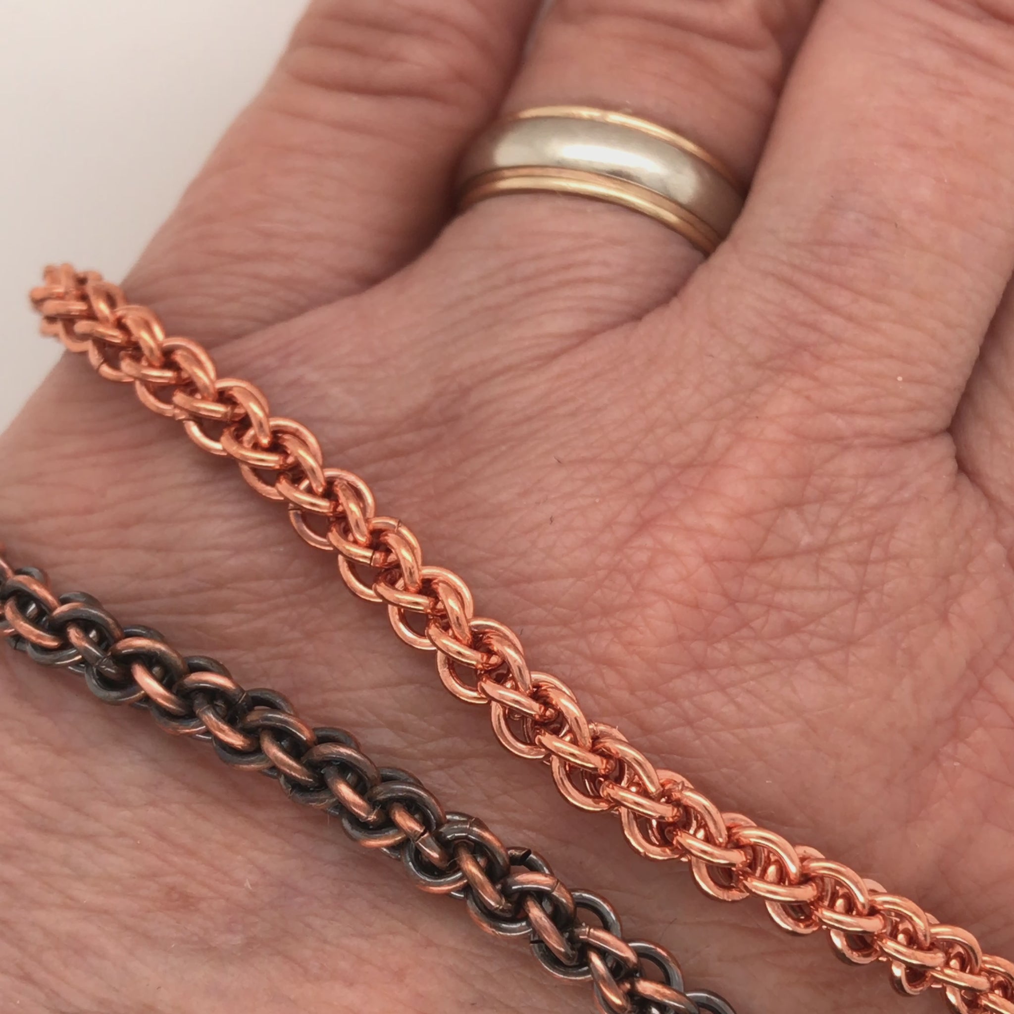 Movie, spiral weave copper bracelets (Jens Pind, JPL3), natural finish and patinated, showing how they roll on the wrist and how flexible they are.